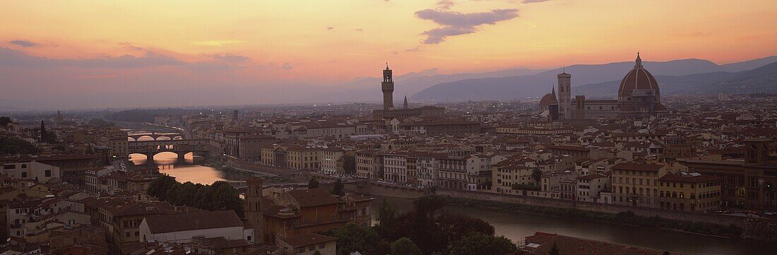 View at dusk over rooftops of Florence, showing Duomo, Uffizi and Ponte Vecchio from Pizalle Michelangelo, Florence, Tuscany, Italy, Europe