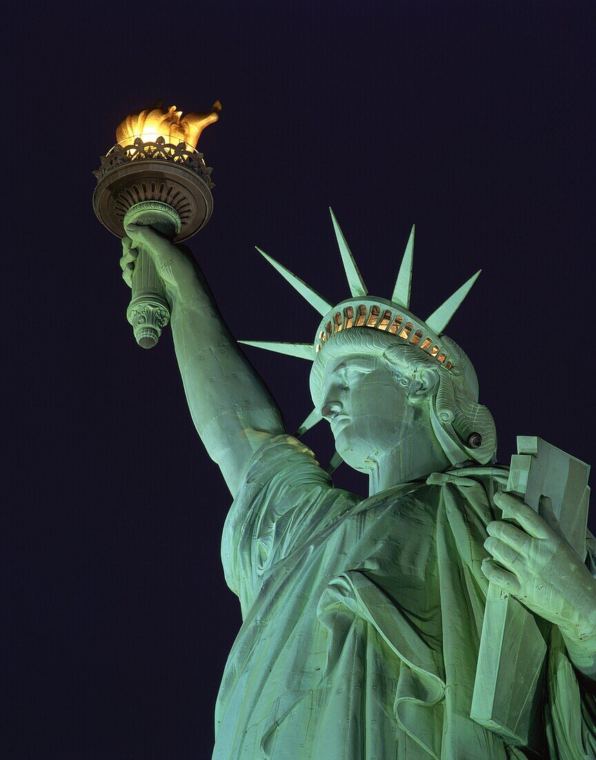 Close-up of the Statue of Liberty illuminated at night, in New York, United States of America, North America