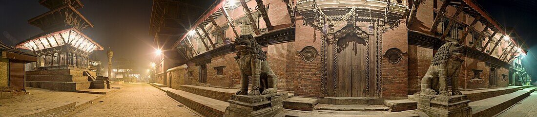 Two stone lions guard the entrance to Mul Chowk courtyard in the Old Royal Palace, with the Hari Shankar Mandir Hindu temple to the left, Durbar Square, UNESCO World Heritage Site, Patan, Kathmandu Valley, Nepal, Asia