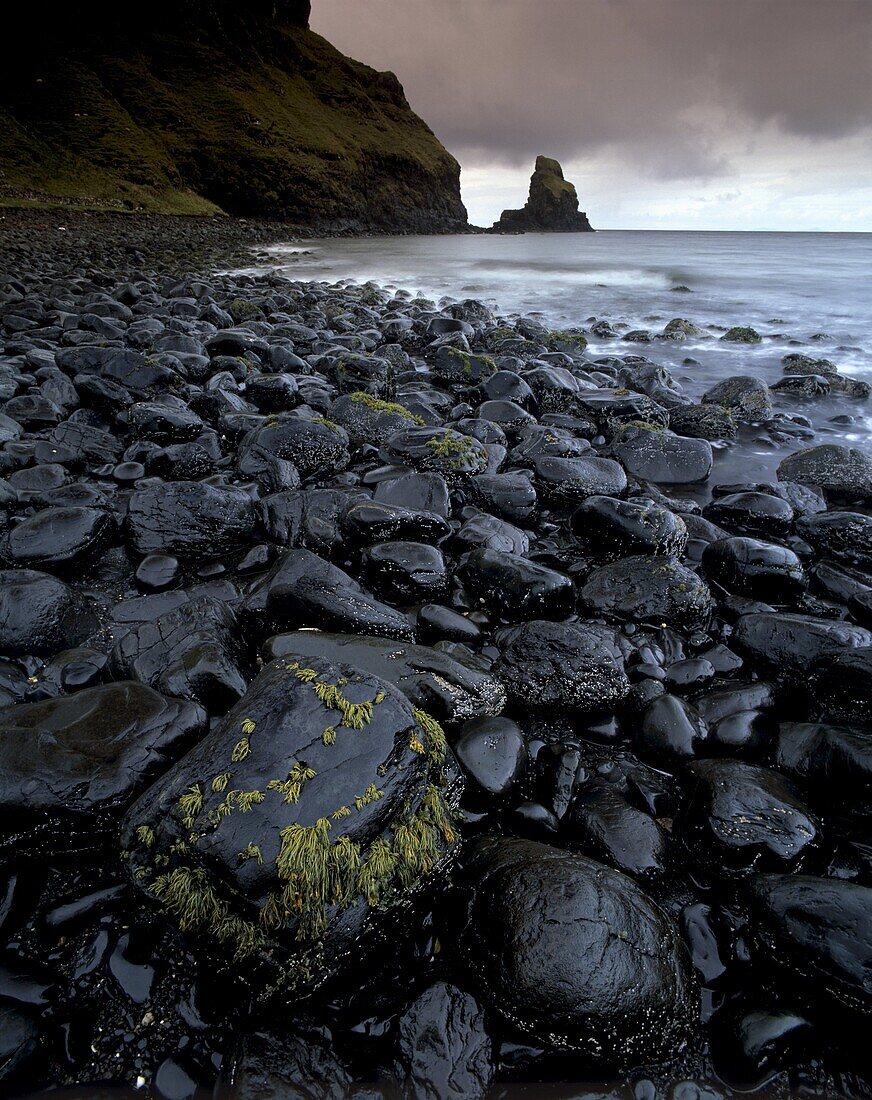 Black boulder rocks in Talisker Bay, Isle of Skye, Inner Hebrides, Scotland, United Kingdom, Europe