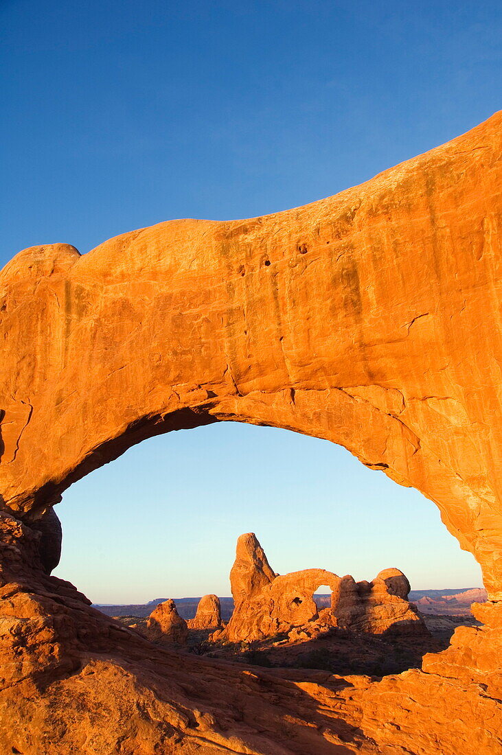 Sunrise on North Arch and Tower Arch in the Windows section of Arches National Park, Utah, United States of America, North America