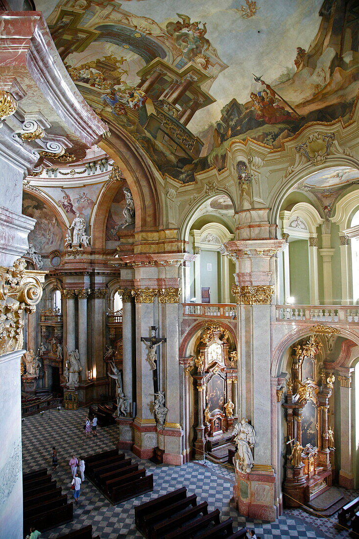 The Baroque interior of St. Nicholas Church in Mala Strana, Prague, Czech Republic, Europe
