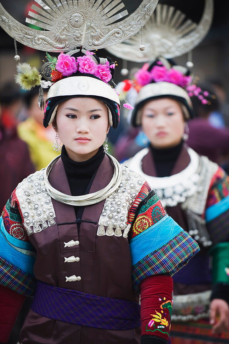 Women in ethnic costume at a Lunar New Year festival in the Miao village of Qingman, Guizhou Province, China, Asia