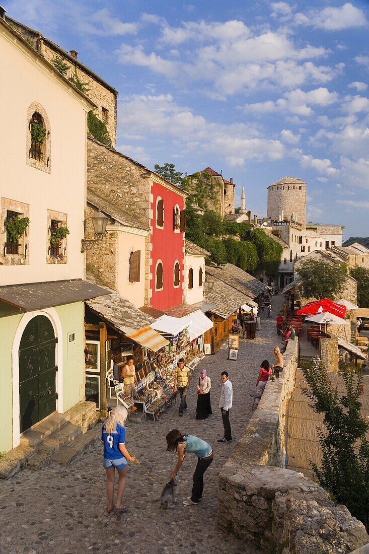 Cobbled street lined with colourful houses known as Kujundziluk, one of the oldest streets in Mostar leading to the Old Bridge, Old Town, UNESCO World Heritage Site, Mostar, Herzegovina, Bosnia Herzegovina, Europe