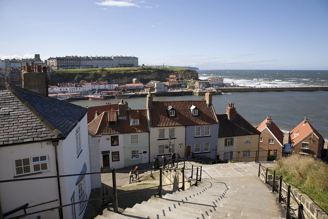 Old Town and River Esk harbour from steps on East Cliff, with West Cliff beyond, Whitby, Heritage Coast of North East England, North Yorkshire, England, United Kingdom, Europe