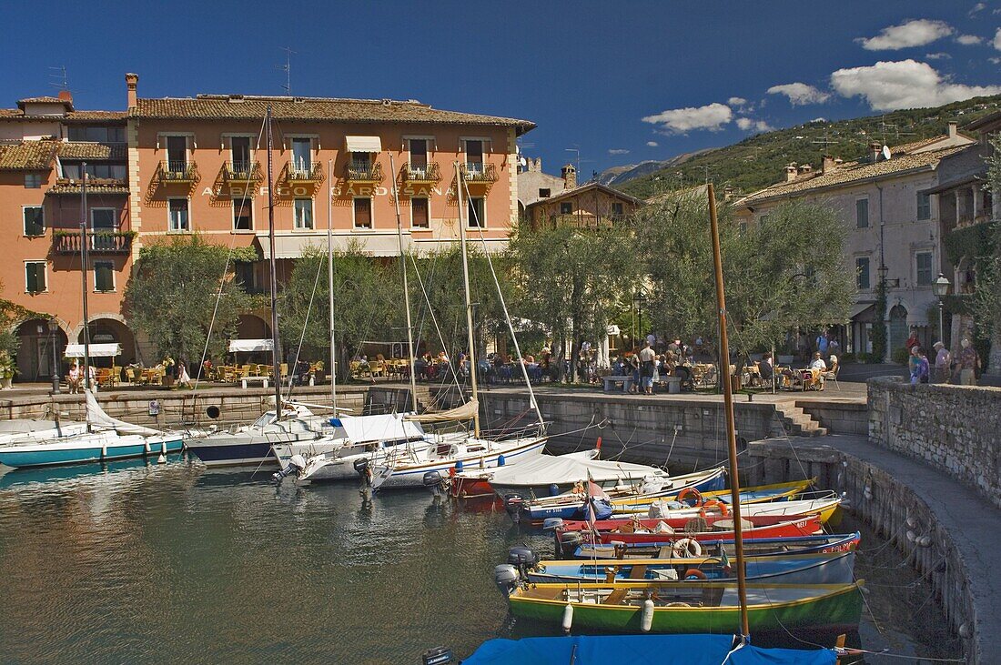 The harbour and waterside cafe, Torre del Benaco, Lake Garda, Veneto, Italy, Europe
