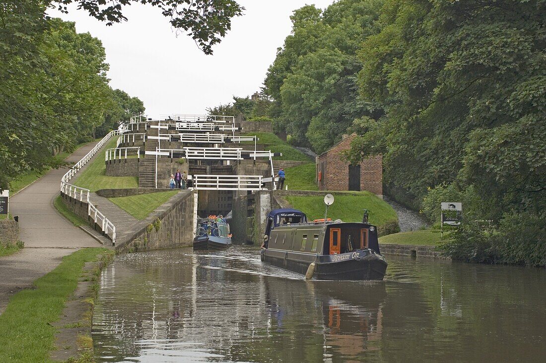 Narrow boats on the Liverpool Leeds canal, negotiating the five lock ladder at Bingley, Yorkshire, England, United Kingdom, Europe