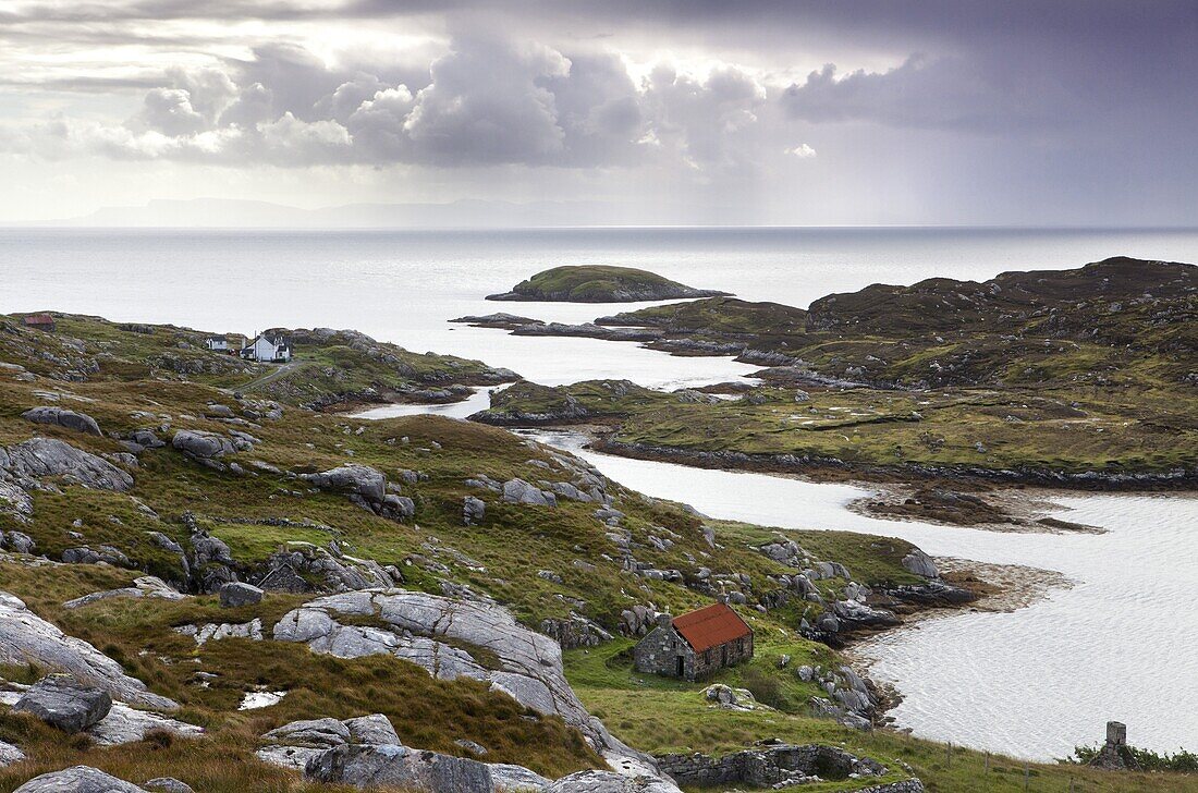 View out to sea over abandoned crofts at the township of Manish on the east coast of the Isle of Harris, Outer Hebrides, Scotland, United Kingdom, Europe