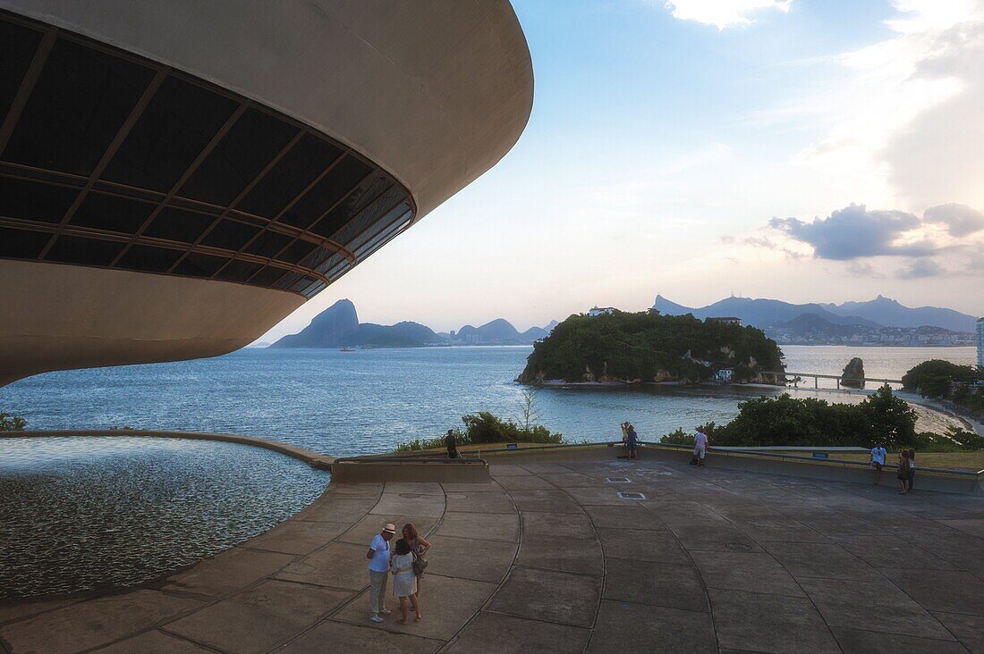 Niemeyer Museum of Contemporary Arts at sunset, and view over Sugar Loaf and Guanabara Bay, Niteroi, Rio de Janeiro, Brazil, South America