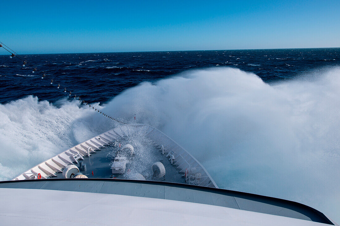 Huge wave crashes against bow of expedition cruise ship MS Hanseatic (Hapag-Lloyd Cruises) in stormy Atlantic Ocean between Buenos Aires in Argentina and Port Stanley in the Falkland Islands, South Atlantic Ocean, near Falkland Islands, British Overseas T