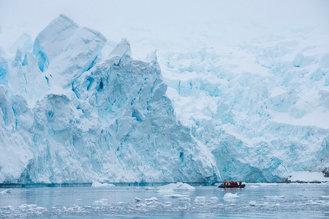 Zodiac dinghy excursion though iceberg landscape for passengers from expedition cruise ship MS Hanseatic (Hapag-Lloyd Cruises), Paradise Bay (Paradise Harbor), Danco Coast, Graham Land, Antarctica