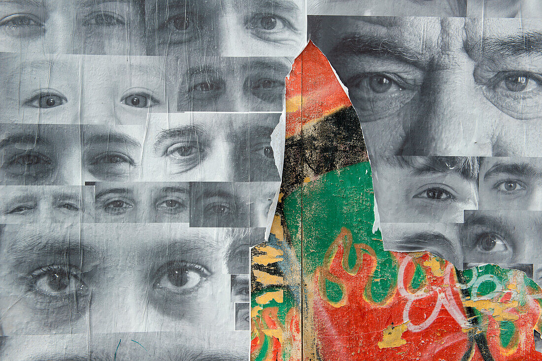 Reklamewand mit abgerissenen Bildern von Augen, Ushuaia, Feuerland, Patagonien, Argentinien, Südamerika