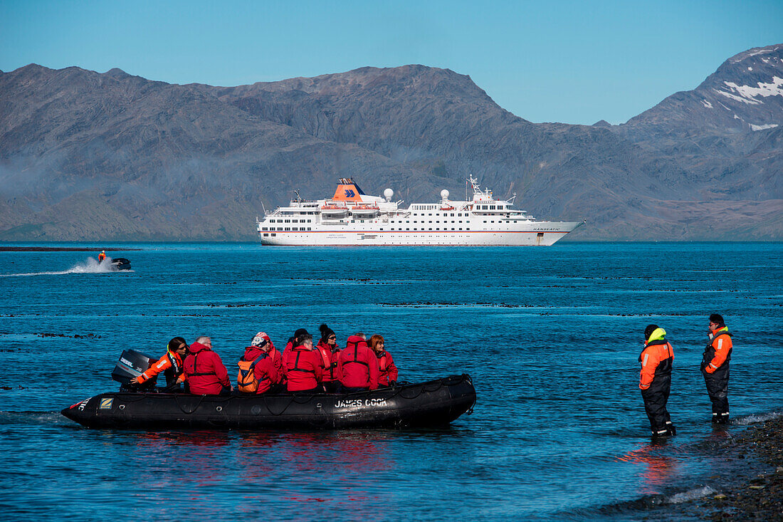 Zodiac dinghy landing for passengers of expedition cruise ship MS Hanseatic (Hapag-Lloyd Cruises), Grytviken, South Georgia Island, Antarctica