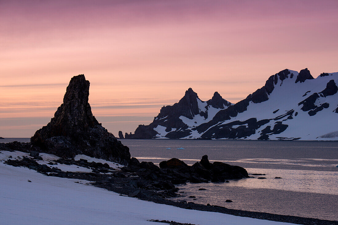 Rugged rocks and mountains at sunrise, Half Moon Island, South Shetland Islands, Antarctica