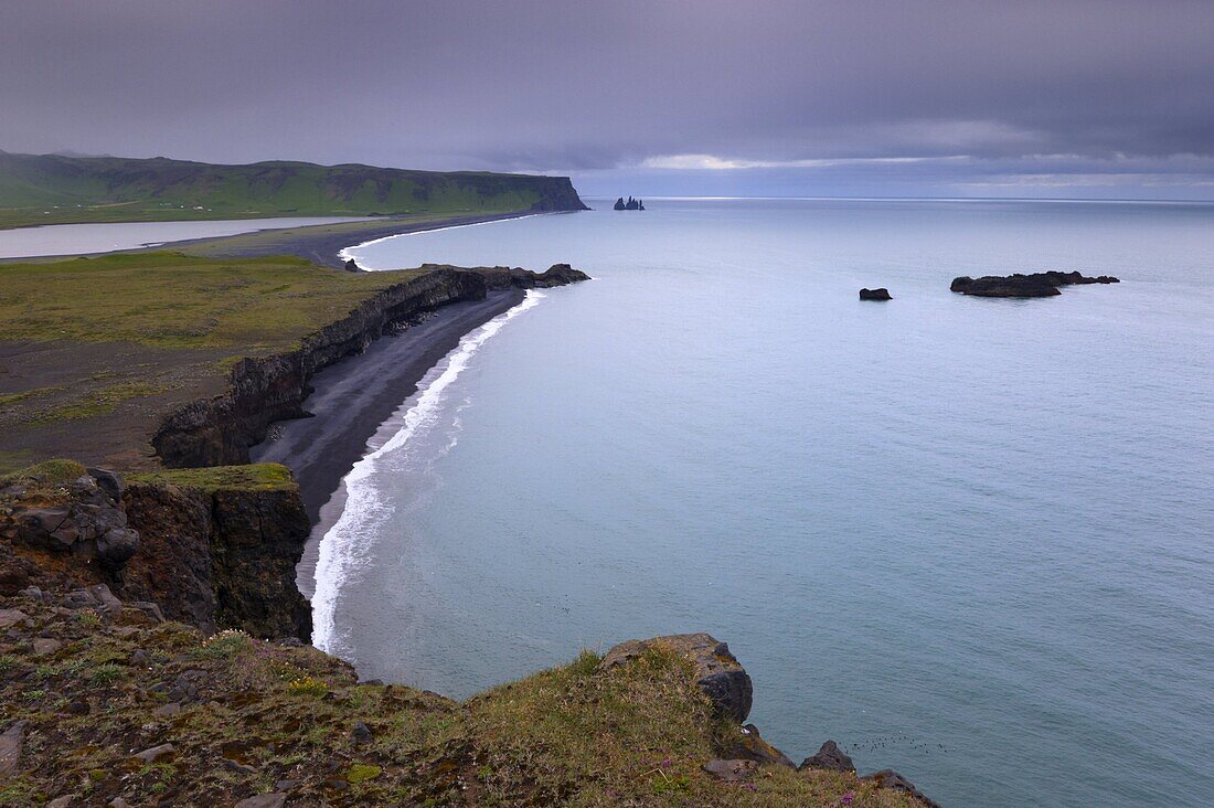 Reynisfjara black sand beach and Reynisdrangar sea stacks in the distance, from Dyrholaey near Vik, Iceland, Polar Regions