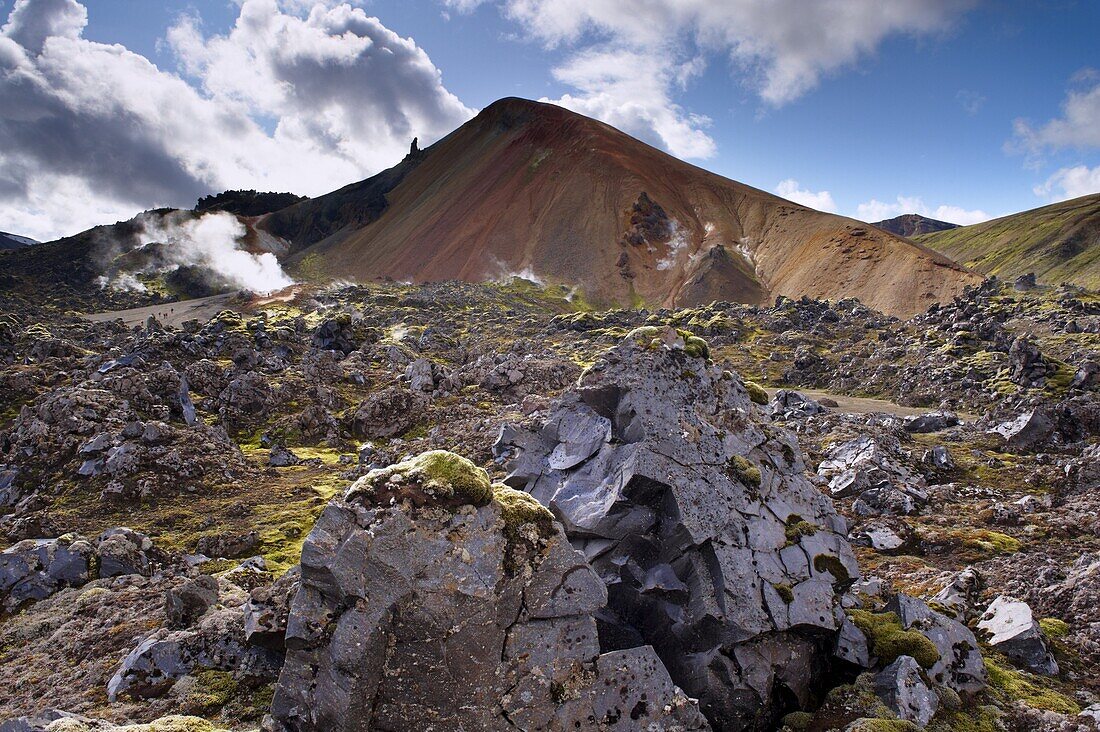 Brennisteinsalda, 855 m, Iceland's most colourful mountain, dominates the lava fields of Laugahraun, Landmannalaugar area, Fjallabak region, Iceland, Polar Regions
