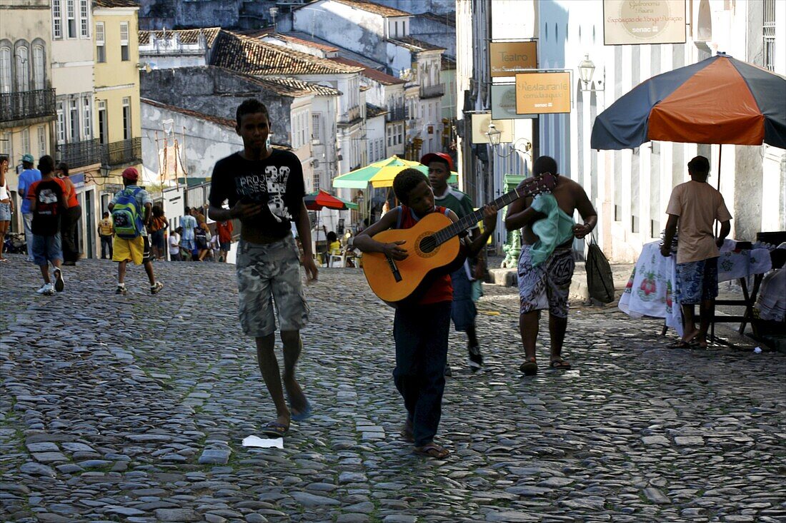 A young guitarist in the Pelourinho district, Salvador de Bahia, Brazil, South America