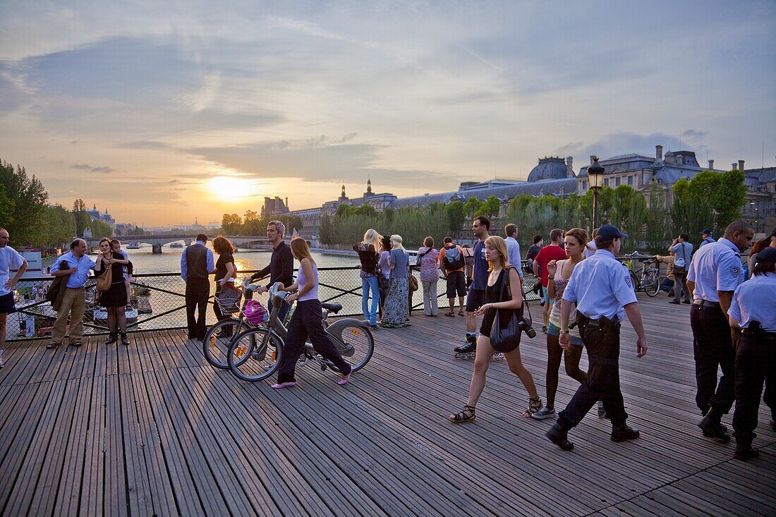 People enjoying the sunset, Pont des Arts, Paris, France, Europe