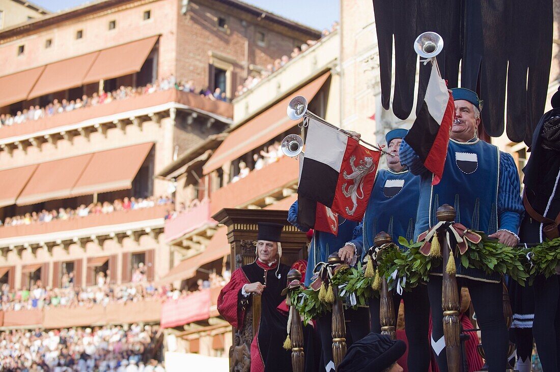Bugle player in a parade at El Palio horse race festival, Piazza del Campo, Siena, Tuscany, Italy, Europe