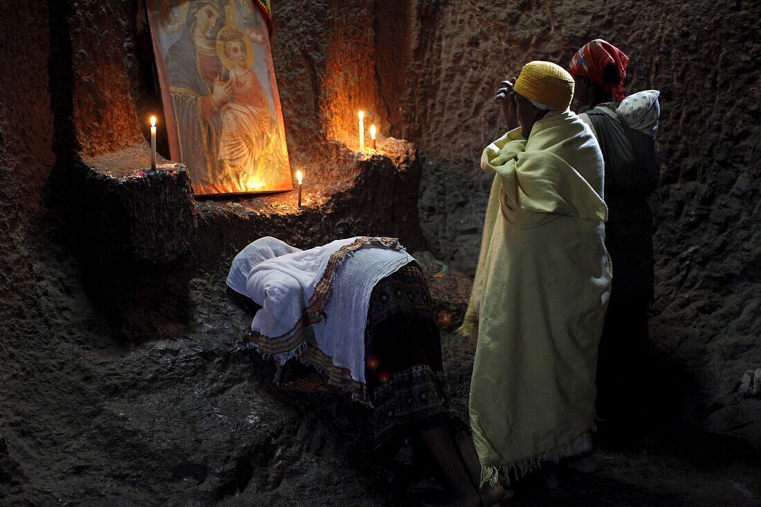 Women praying in Bet Medhane Alem church in Lalibela, Wollo, Ethiopia, Africa