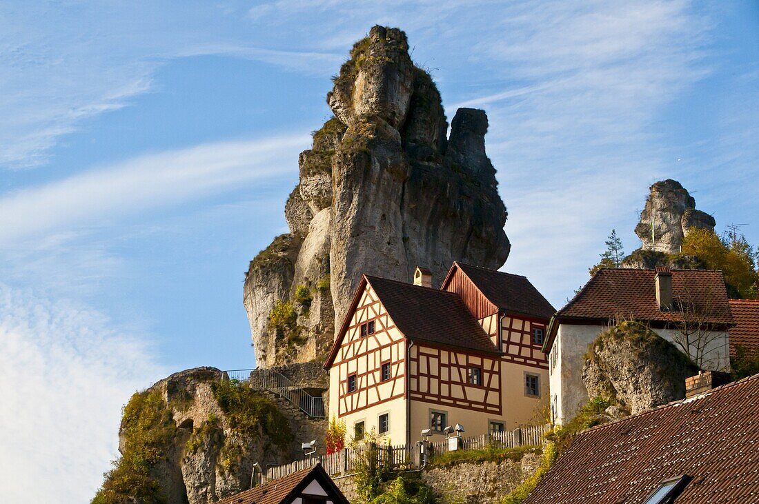 Timbered houses and huge rocks in Tuchersfeld, a village in the Franconian Switzerland region, Bavaria, Germany, Europe