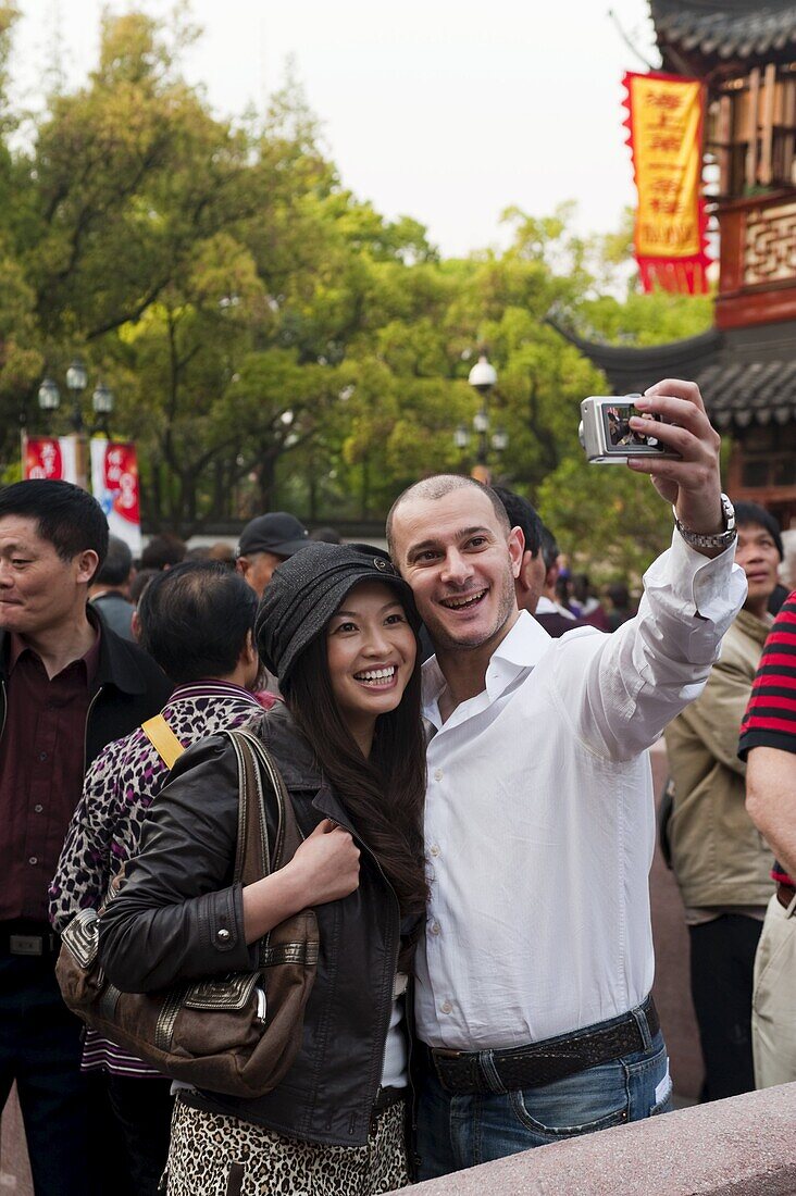 Tourists taking their own photograph at Yu Yuan Garden, Huangpu District, Shanghai, China, Asia