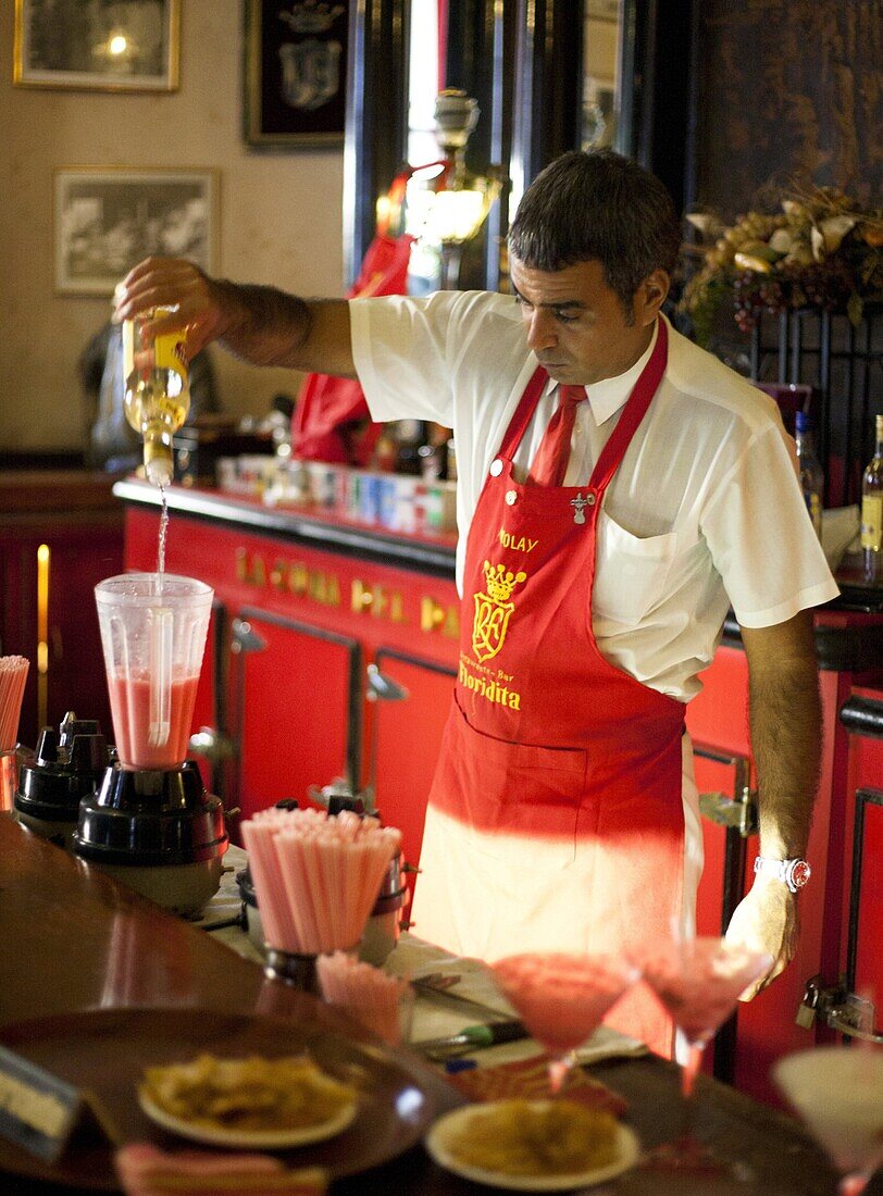 Barman mixing strawberry Daquiris in Bar El Floridita, a favourite drinking spot of late author Ernest Hemingway, Havana, Cuba, West Indies, Central America