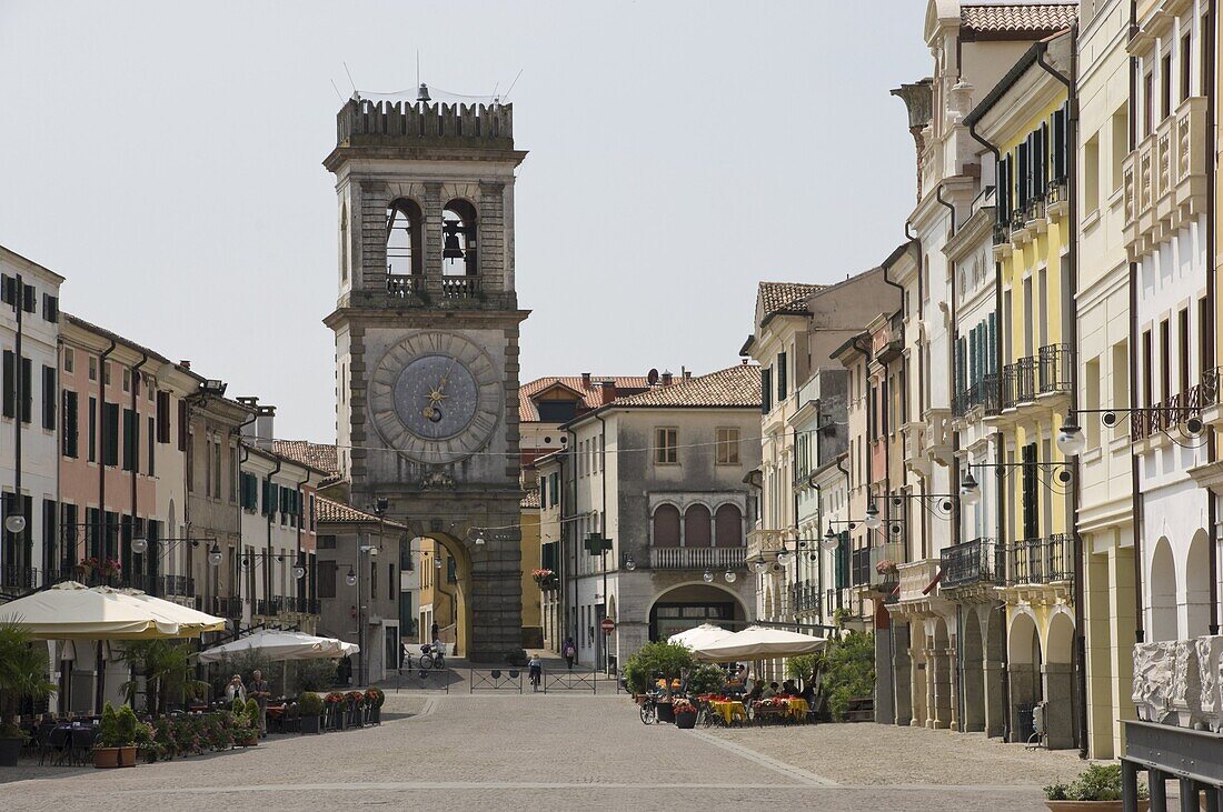 Street cafes and the Town Gate with ornamental clock tower, Este, Veneto, Italy, Europe