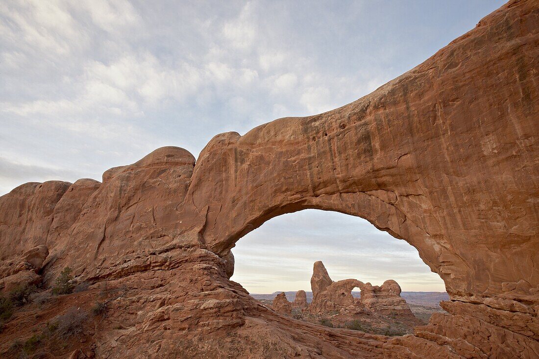 Turret Arch through North Window at dawn, Arches National Park, Utah, United States of America, North America