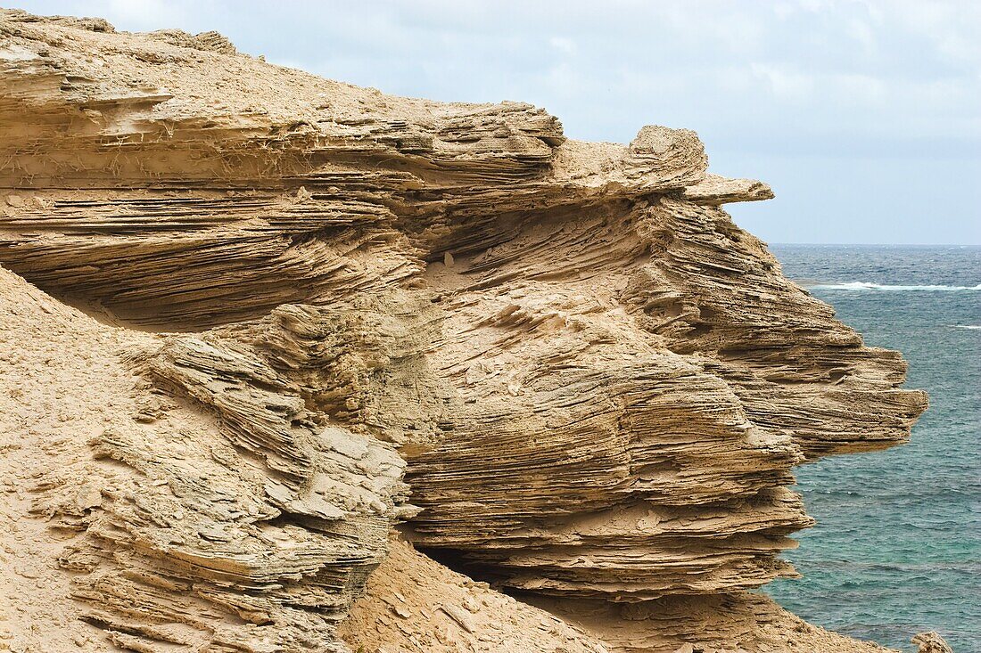 Limestone outcrop showing classic cross bedding created by ancient dune sands, at Hamelin Bay on the coast north of Cape Leeuwin at the south western tip of Australia, Augusta-Margaret River Shire, Western Australia, Australia, Pacific