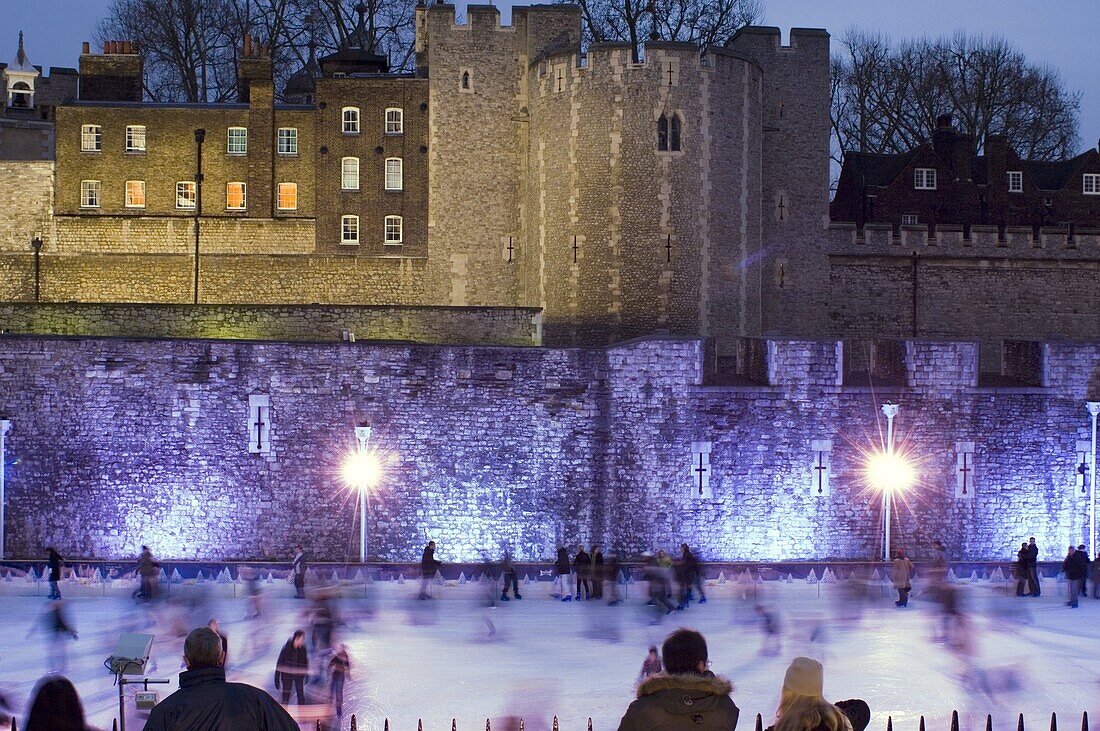 Skaters on the ice rink next to The Tower of London, London, United Kingdom, Europe