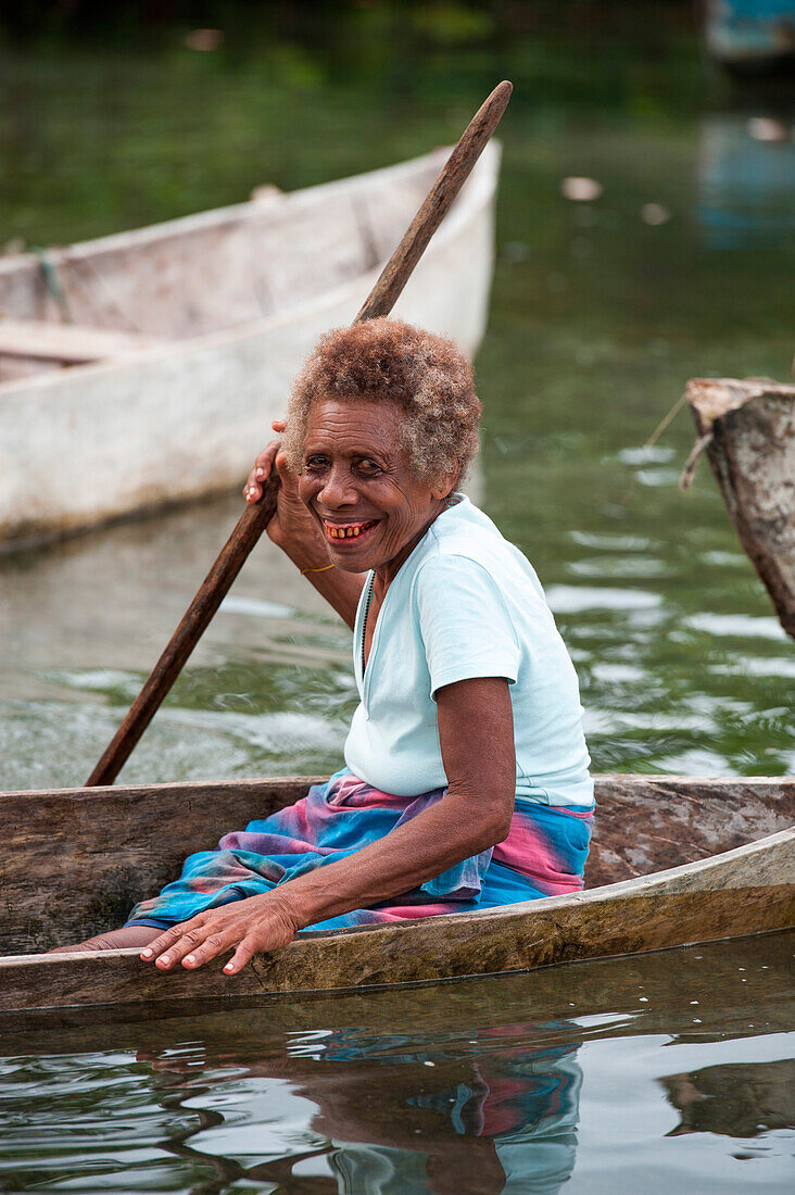 Elderly woman in canoe, Nendo Island, Santa Cruz Islands, Solomon Islands, South Pacific
