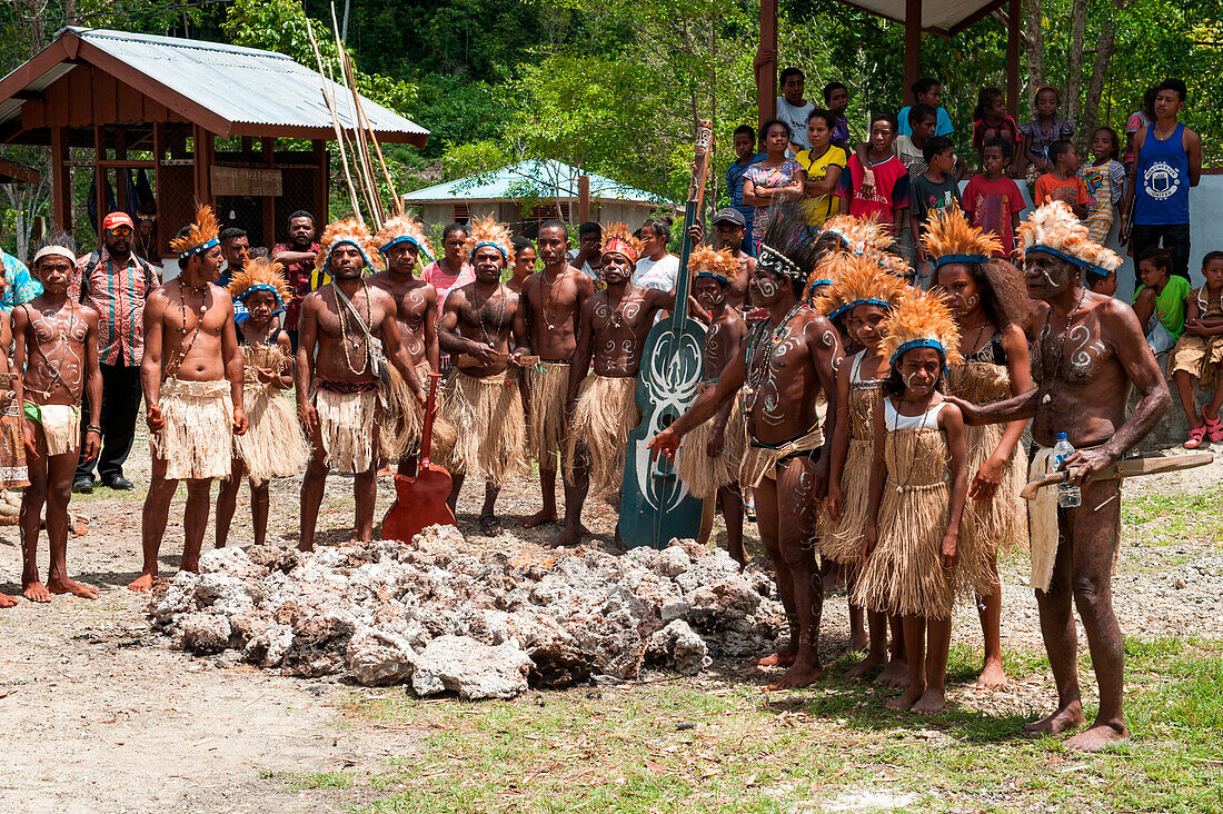 Tribespeople pose after traditional dance and firewalking performance, Biak, Papua, Indonesia, Asia