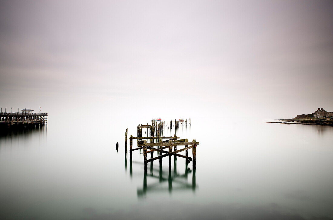 Remains of the old pier on misty morning, Swanage, Dorset, England, United Kingdom, Europe