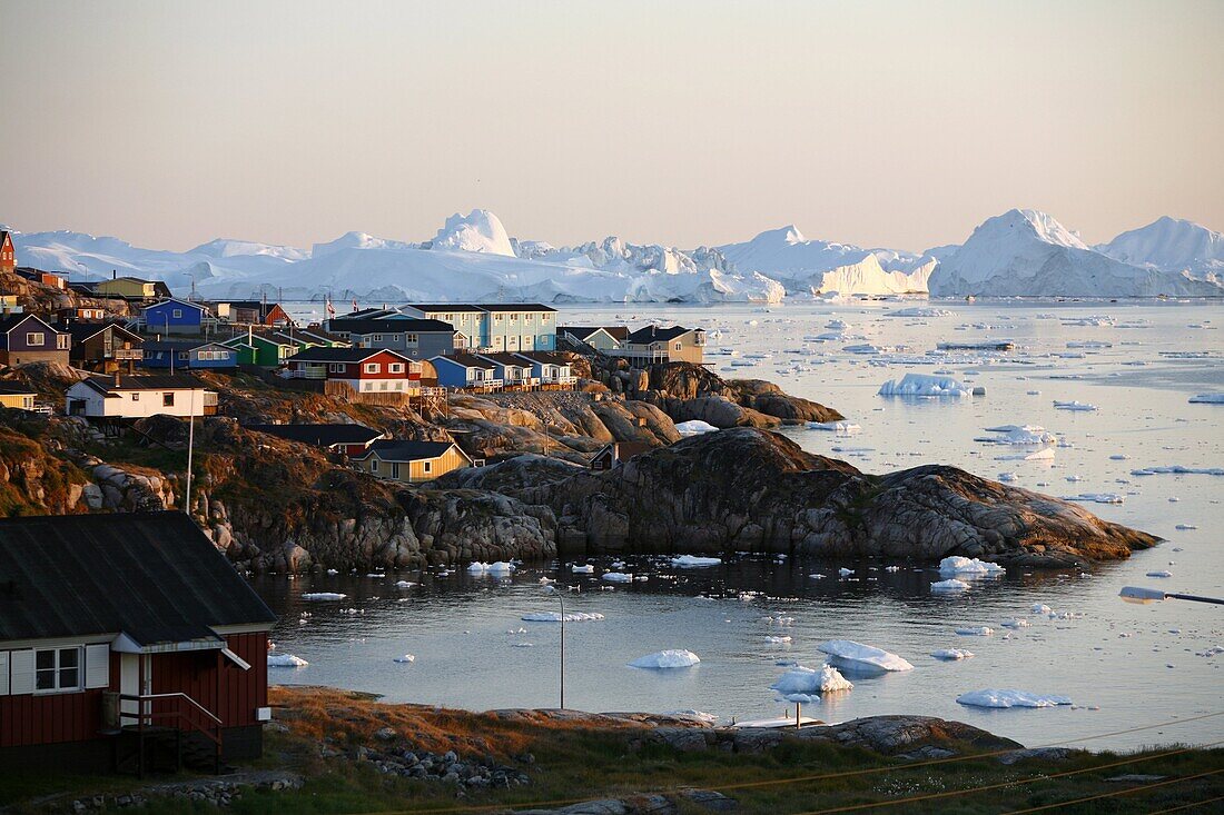 A view over houses and the Ilulissat Kangerlua Glacier also known as Sermeq Kujalleq, Ilulissat, Disko Bay, Greenland, Polar Regions