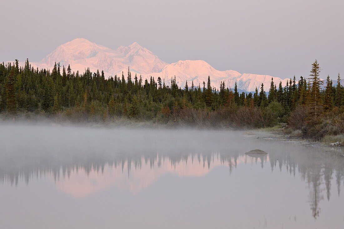 Mount McKinley (Mount Denali) reflected in a lake along the Denali Highway, Alaska, United States of America, North America