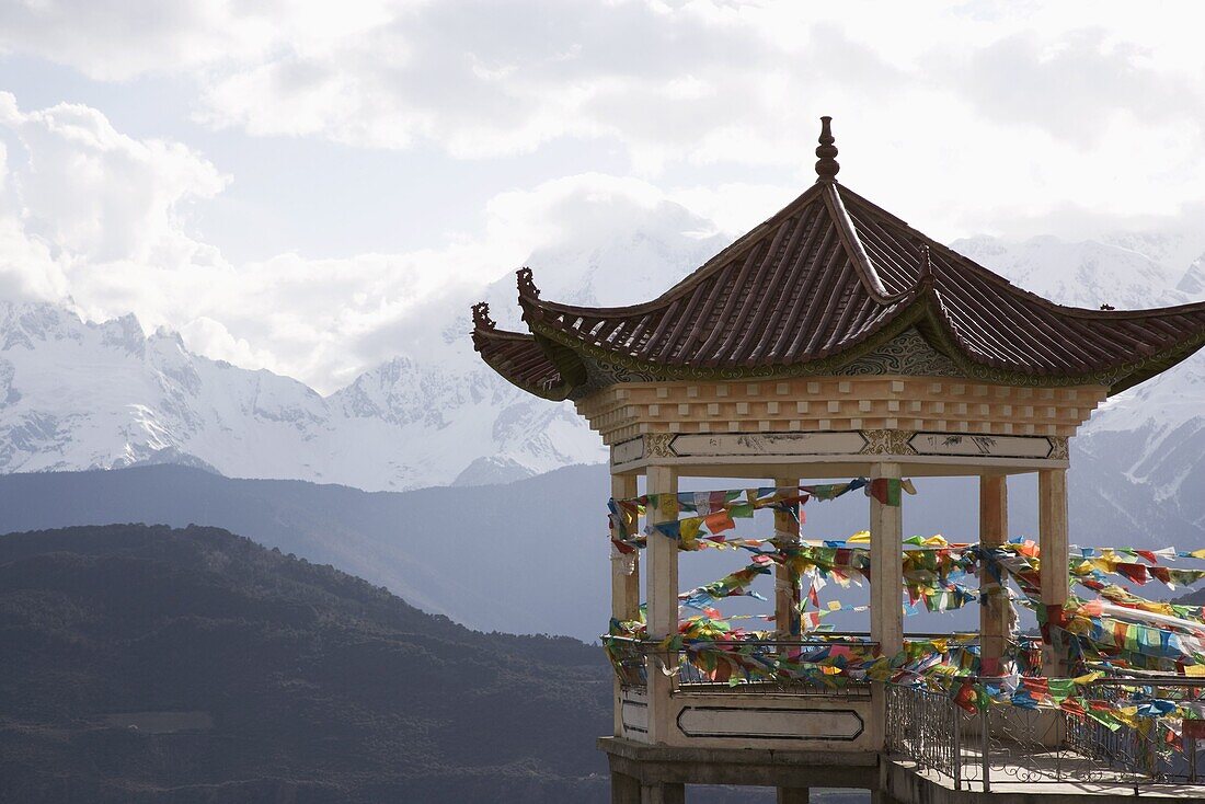 Buddhist stupa on way to Deqin, on the Tibetan Border, with the Meili Snow Mountain peak in the background, Dequin, Shangri-La region, Yunnan Province, China, Asia