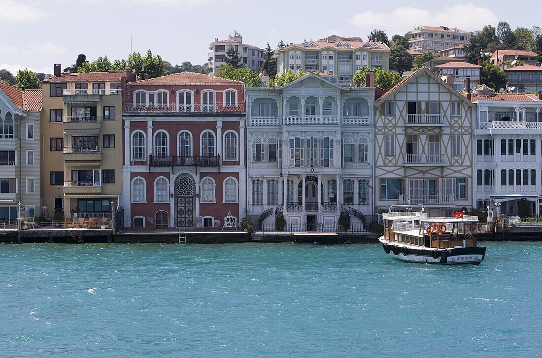 The restored waterfront buildings of Yenikoy on the Bosphorus, Istanbul, Turkey, Europe