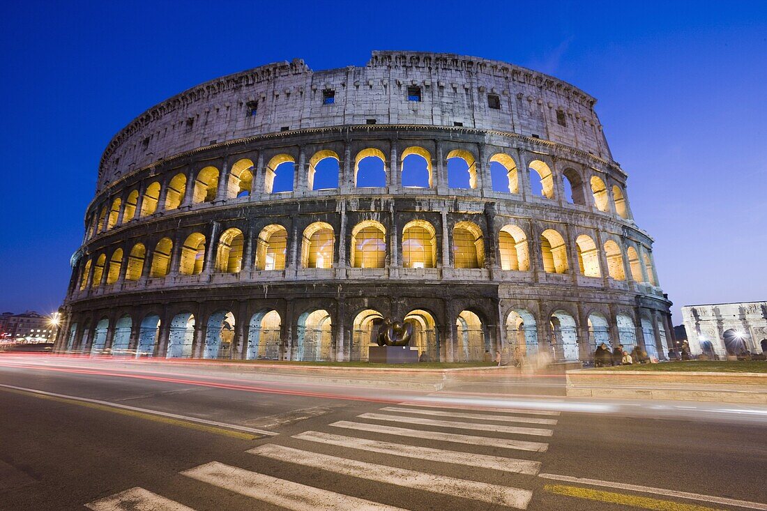 Colosseum amphitheatre, UNESCO World Heritage Site, and via Dei Fori Imperiali at night, Rome, Lazio, Italy, Europe