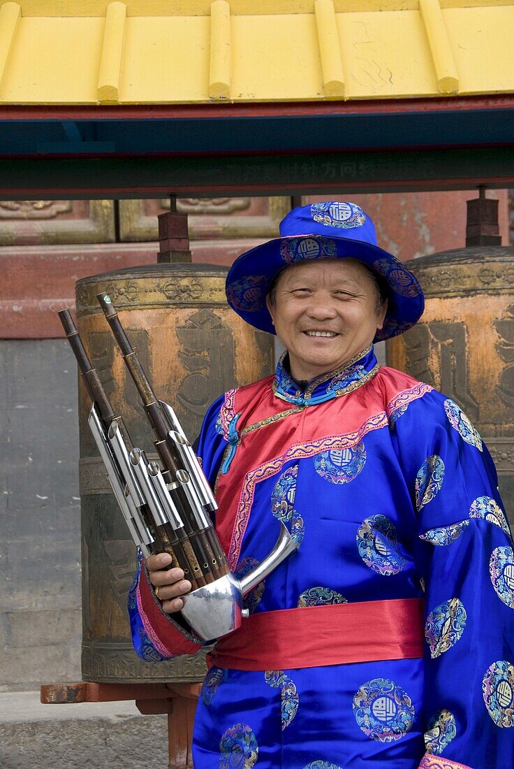 Chinese musician in traditional costume, Puning Temple, Chengde, Hebei, China, Asia