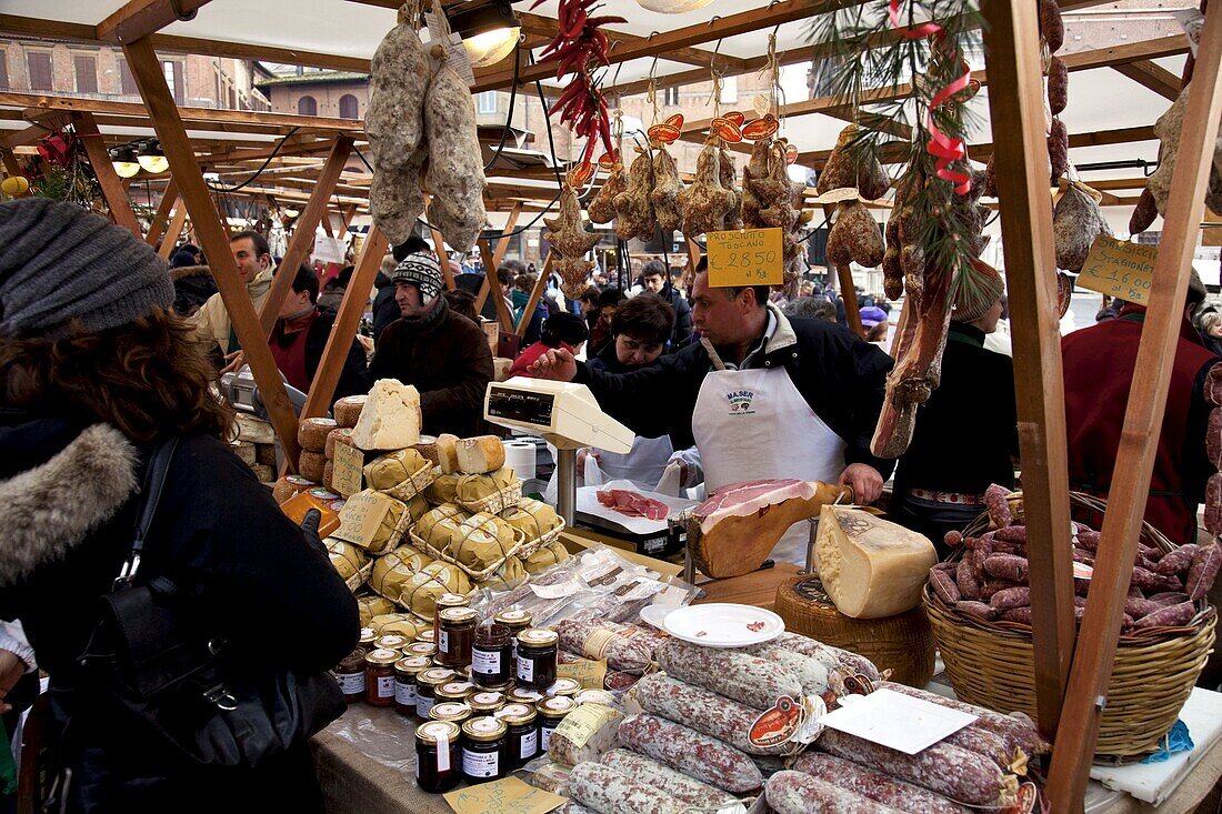 Market stalls selling typical salami and pecorino cheese at Piazza del Campo, Siena, Tuscany, Italy, Europe