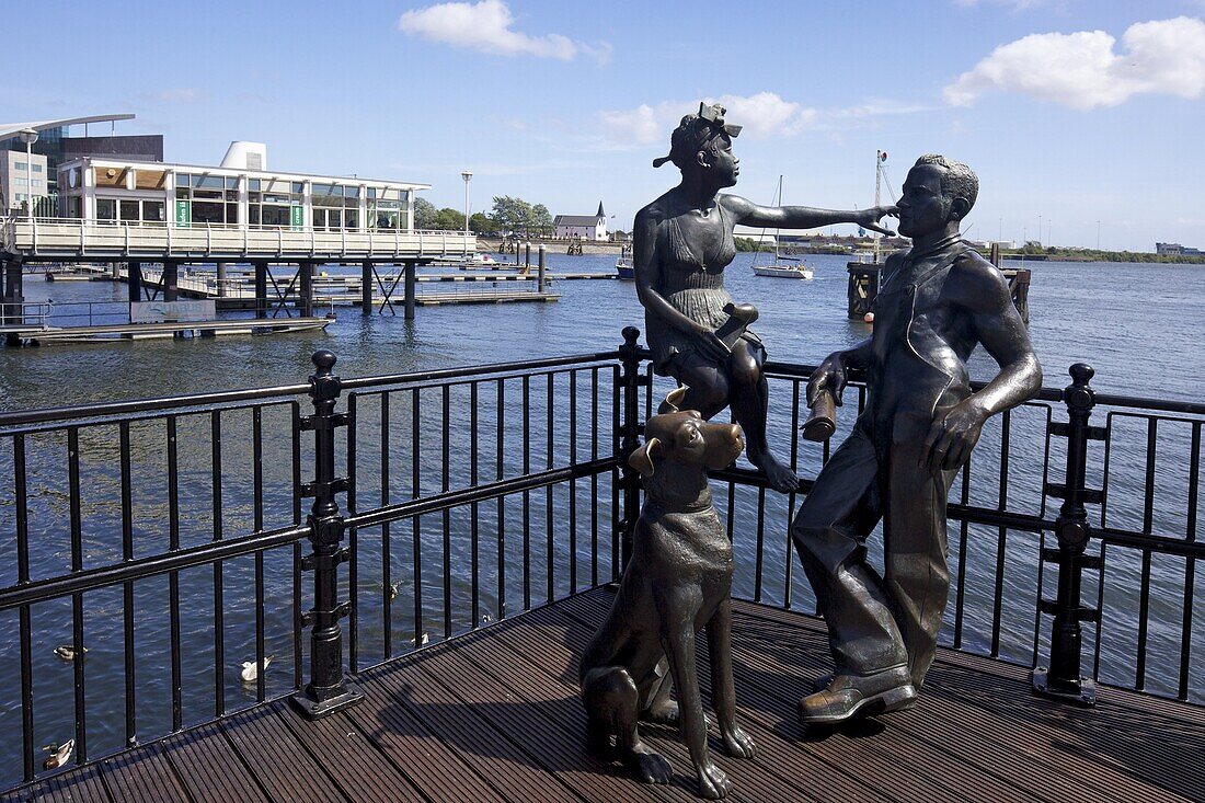 People Like Us, bronze sculpture of a young local couple with their dog, by John Clinch, 1993, Mermaid Quay, Cardiff Bay, South Glamorgan, Wales, United Kingdom, Europe
