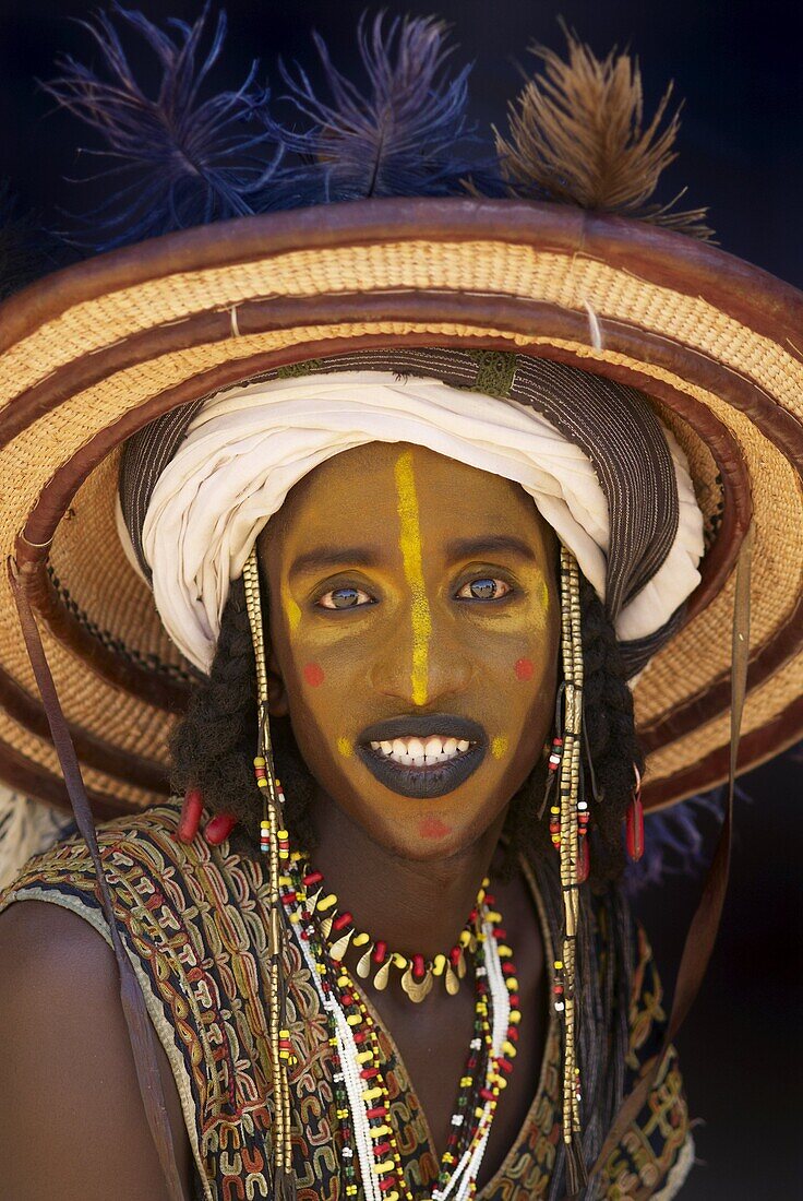 Wodaabe (Bororo) man with his face painted at the annual Gerewol male beauty contest, a general reunion of West African Wodaabe Peuls (Bororo Peul), Niger, West Africa, Africa