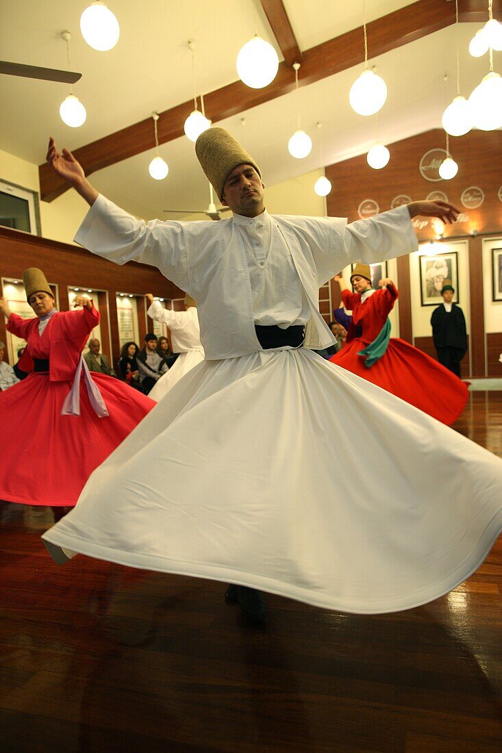 Whirling dervish performance in Silvrikapi Meylana cultural center, Istanbul, Turkey, Europe