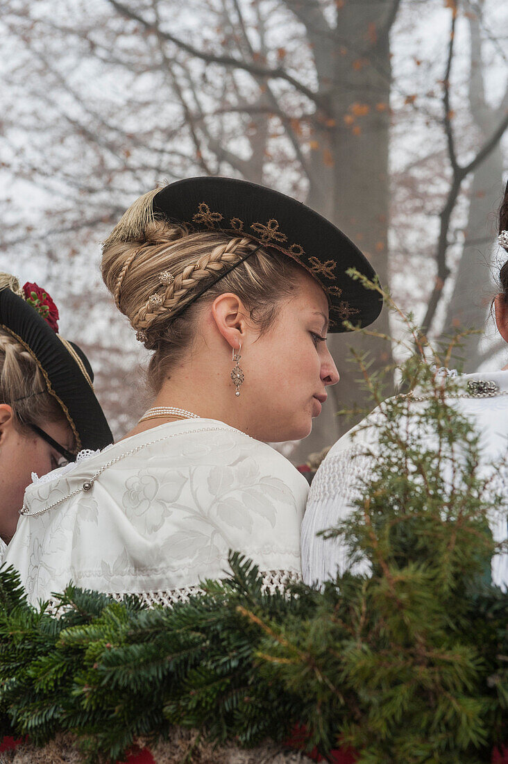 Traditional woman with plaited hair, Leonhardi procession, Bad Toelz, Upper Bavaria, Bavaria, Germany