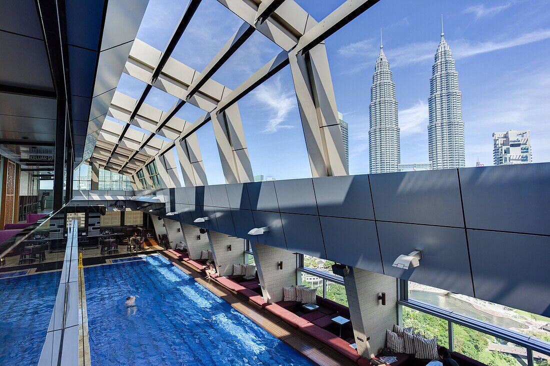 View from a rooftop pool and skybar of the iconic 88 Petronas Towers, Kuala Lumpur, Malaysia, Southeast Asia, Asia