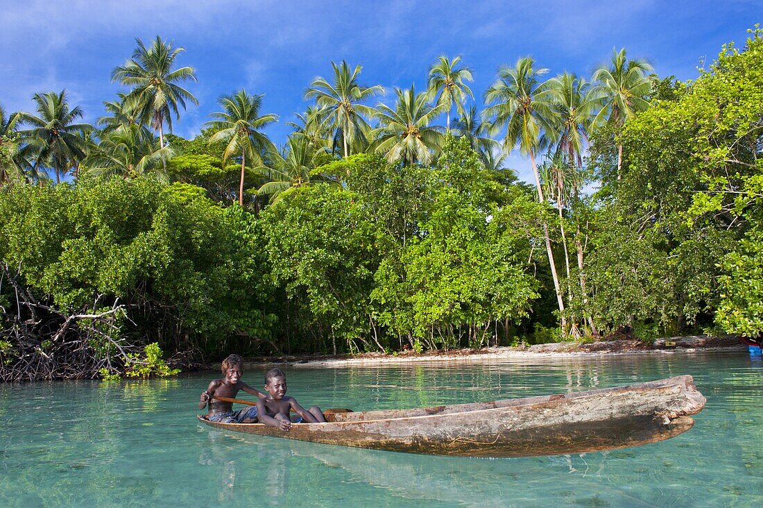 Young boys fishing in the Marovo Lagoon, Solomon Islands, Pacific