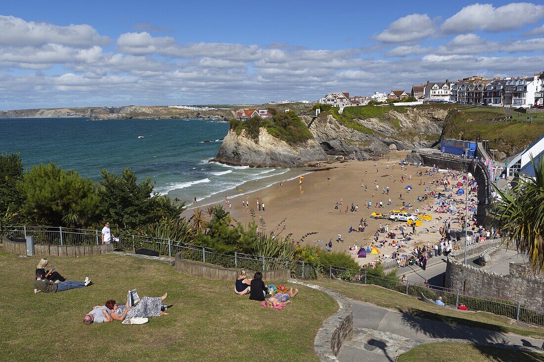 People relaxing in park above Towan beach, Newquay, Cornwall, England, United Kingdom, Europe