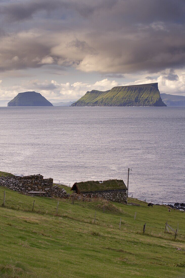 Islands of Stora Dimun on the right, and Litla Dimun, from Skarvanes, Sandoy Island, Faroe Islands (Faroes), Denmark, Europe