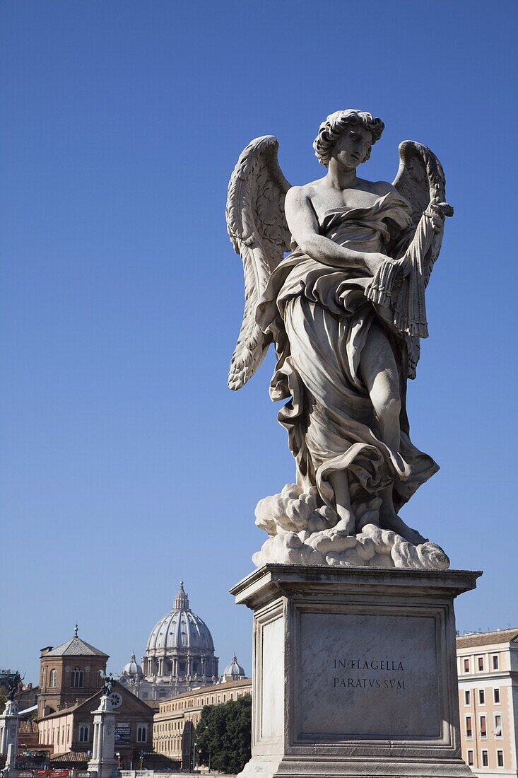 Angel statue on Ponte Sant' Angelo (Bridge of Angels), with the dome of the Vatican in distance, Rome, Lazio, Italy, Europe